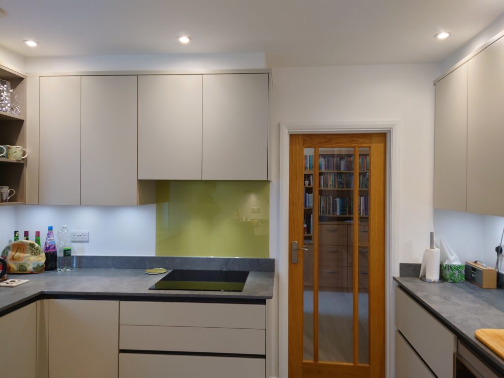 Light grey handleless kitchen in Storrington